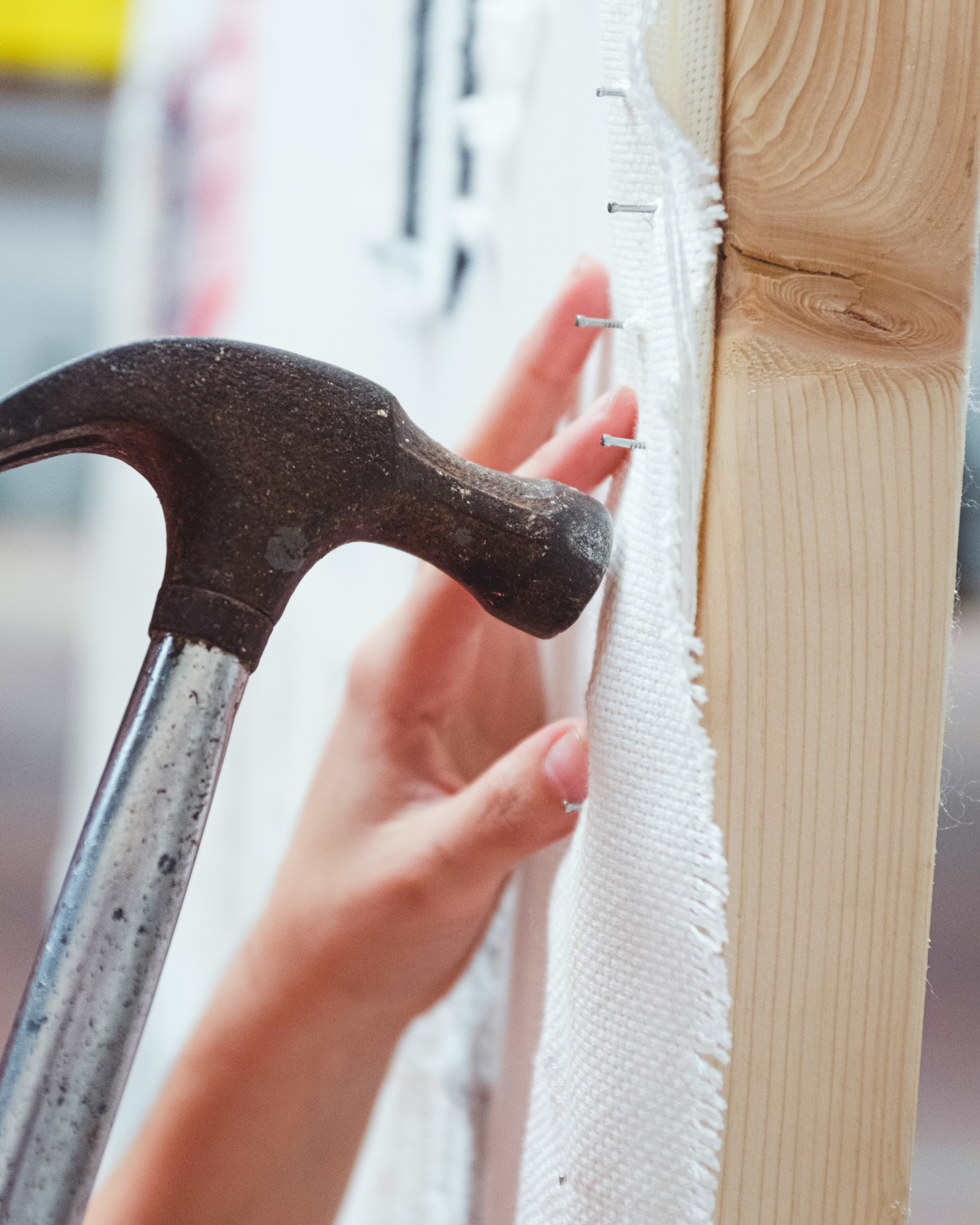 Multi-purpose hammer with rubberized grip